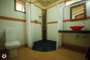 Enclosed bathroom- toilet- shower -hot water