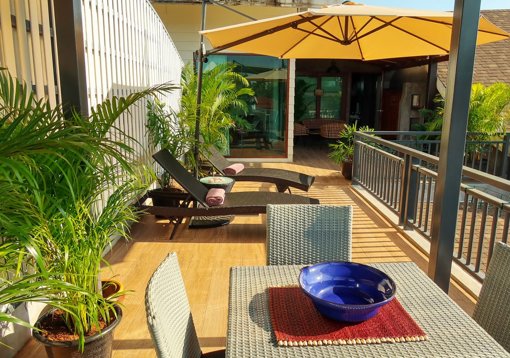 Image showcasing seaflower-bungalows-penthouse-poolside-seating - Seaflower Beach ...